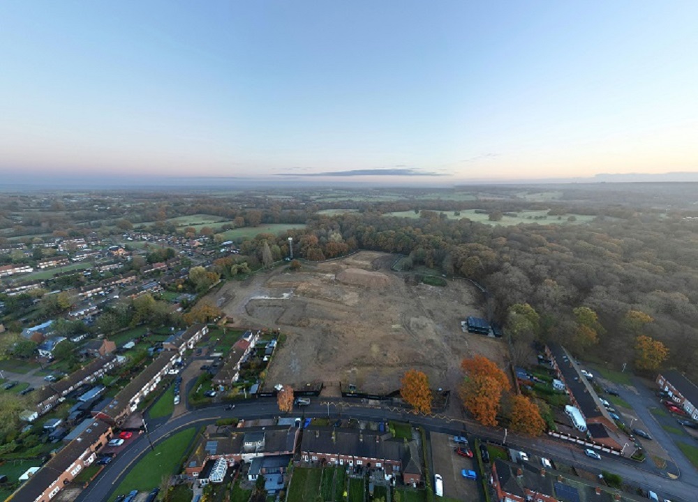 drone image above the site, with blue skies