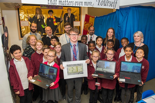 A picture of Cllr White with school children at Minecraft event