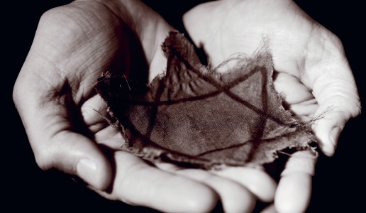 Holocaust Memorial Day image of hands holding a cloth star