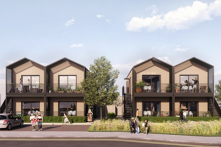 Image shows row of two-storey pitch-roofed homes with established trees and greenery, and blue sky