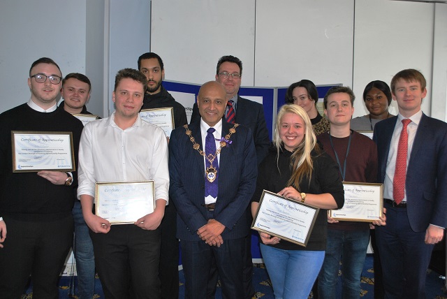 Councillor Dilip Patel, Mayor of Havering, with graduates of the Council apprenticeship scheme.