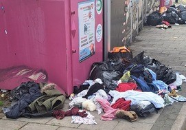 The image shows a common issue for Havering Council officers. Leaving clothes and items outside charity shops or textile banks is fly-tipping and is illegal. Offenders may face investigation and fines.